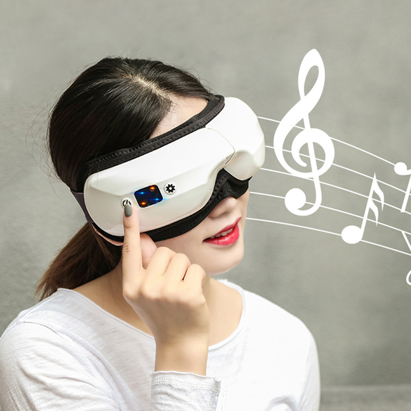 Massager súl cliste le teas, massager súl le haghaidh migraines 6 modhanna le comhbhrú teasa Bluetooth teasa massage súl massager súl téite foldable le haghaidh migraines a chuireann ciorcail dorcha